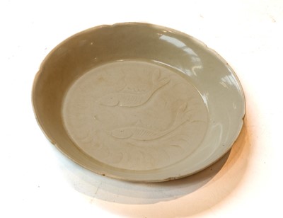 Lot 466 - A Chinese Ding ware shallow bowl, with notched...