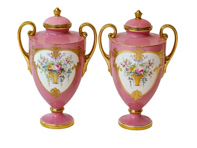 Lot 442 - A pair of Mintons pink ground vases and covers,...