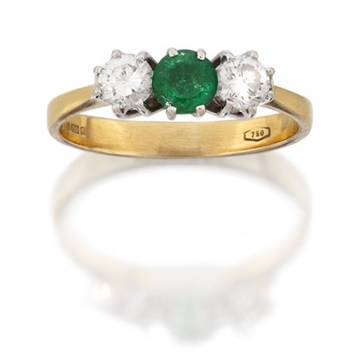 Lot 2125 - An Emerald and Diamond Three Stone Ring