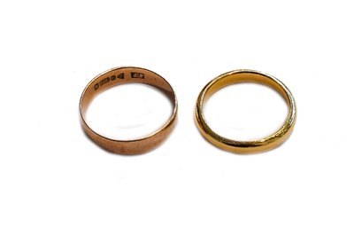 Lot 151 - A 22 carat gold band ring, finger size L1/2;...