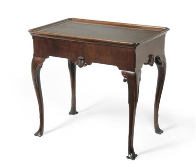 Lot 1140 - An Irish Mahogany Silver Table, the rectangular moulded top with re-entrant corners above a...