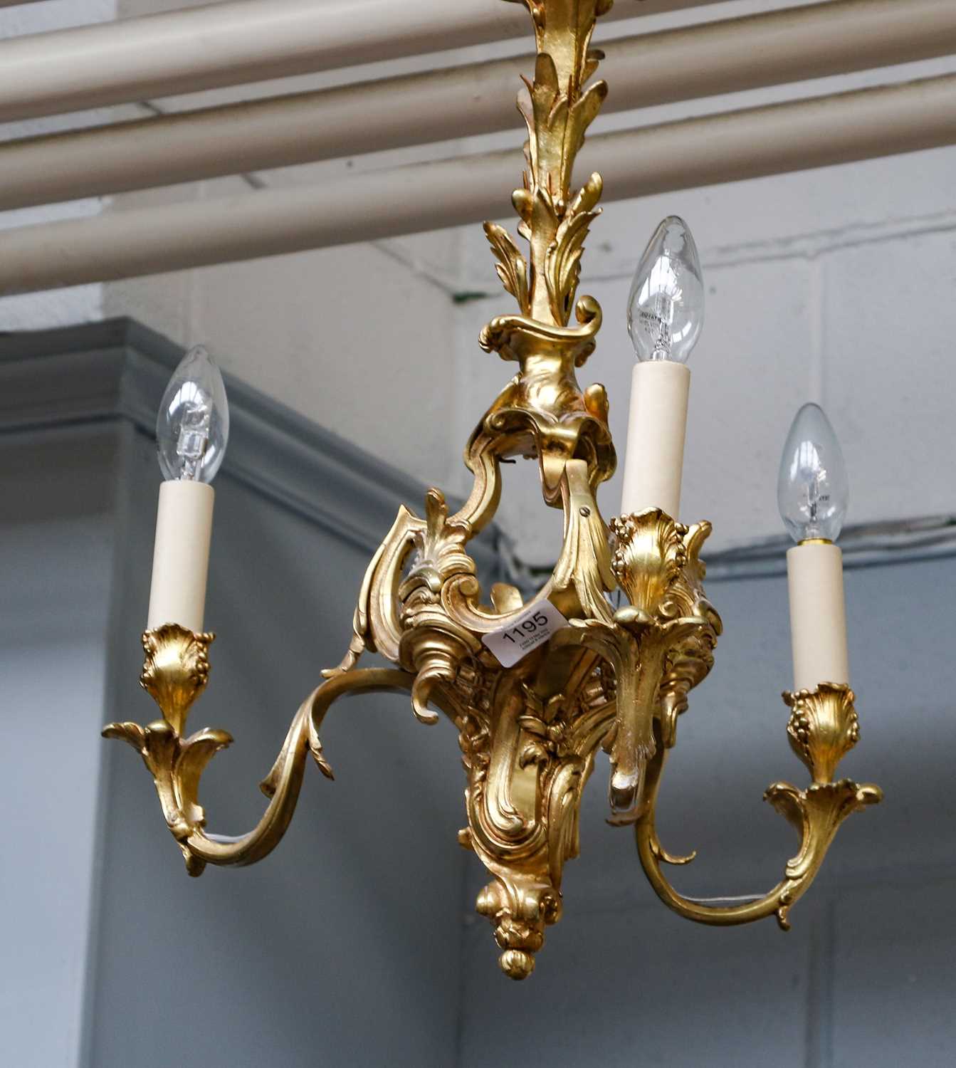 Lot 315 - An ormolu three light chandelier in neo rococo...
