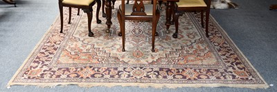 Lot 1013 - A machine made carpet, the cream field with...