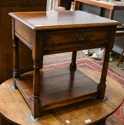 Lot 1112 - A oak single drawer side table in the manner...