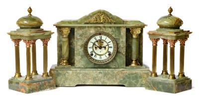 Lot 1235 - A green Onyx striking mantel clock with...