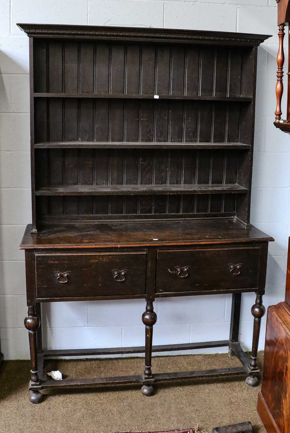 Lot 1108 - An early 20th century dark oak dresser and...