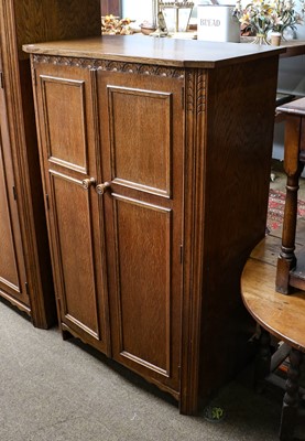 Lot 1114 - A 20th century carved oak three-part bedroom...