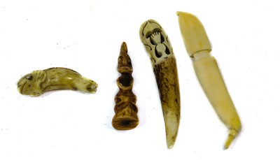 Lot 318 - Three Inuit Amulets, of marine ivory, one...