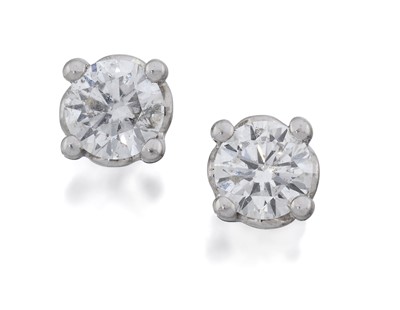 Lot 2147 - A Pair of 18 Carat White Gold Diamond Solitaire Earrings