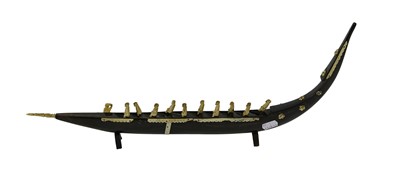 Lot 310 - An Inuit Baleen Boat Carving, set with bone...