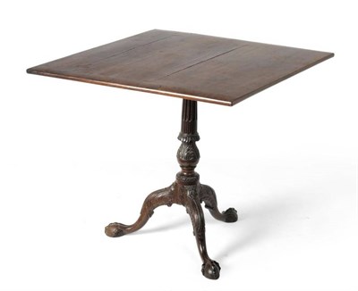 Lot 1147 - A George III Style Mahogany Tripod Table, with later rosewood veneered top above a stop-fluted...