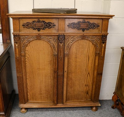 Lot 1231 - A George V oak dining room silver cabinet with...