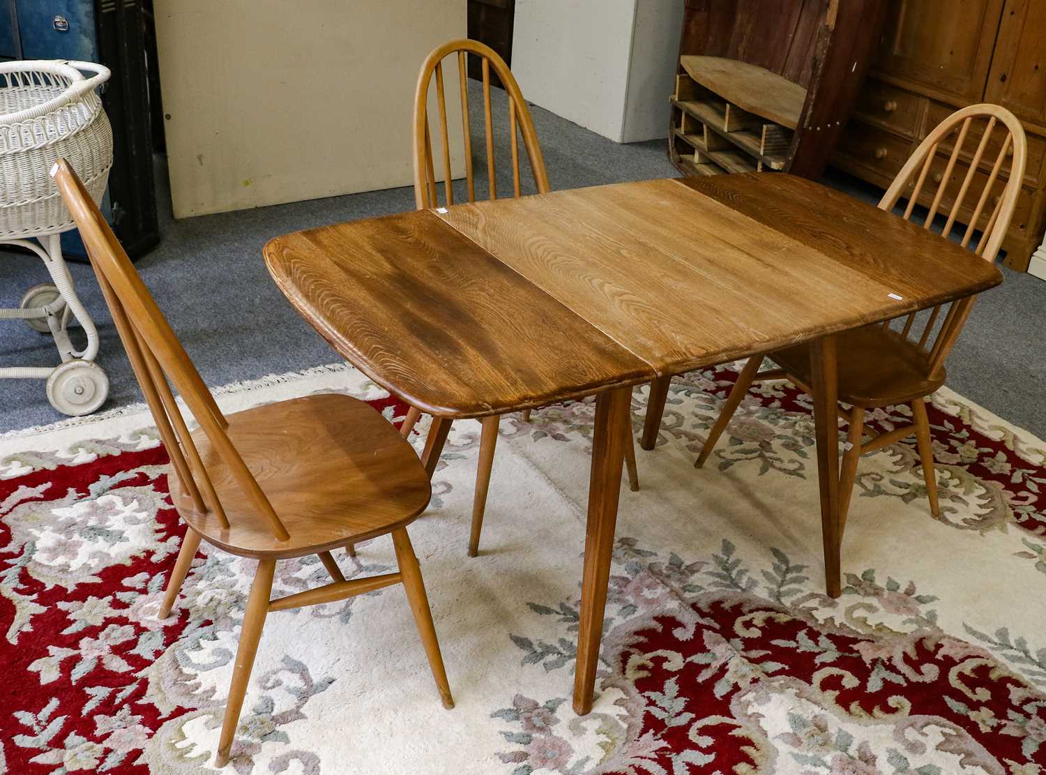 Lot 1260 - An Ercol Windsor drop leaf kitchen table,