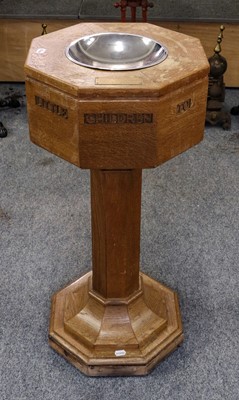 Lot 1216 - A 20th century light oak octagonal church font...