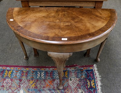 Lot 1117 - A Queen Anne style walnut demi lune table,...