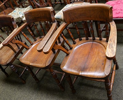 Lot 1154 - A pair of early 20th century oak smokers bow...