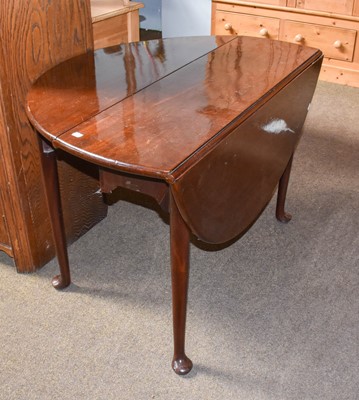 Lot 1213 - A George III mahogany drop leaf table with...