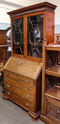 Lot 1173 - A George III mahogany bureau bookcase with...