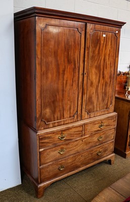 Lot 1193 - A George III mahogany linen press, with Greek...