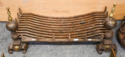 Lot 1215 - A 19th-century fire grate with a pair of steel...