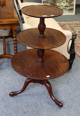 Lot 1218 - A George III mahogany circular three-tier dumb...