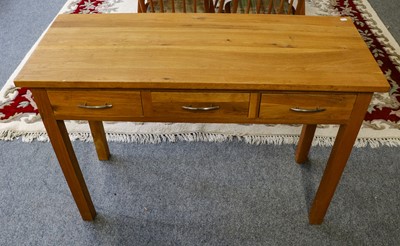 Lot 1261 - A modern light oak three drawer side table...