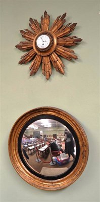 Lot 500 - A 19th century circular gilt framed wall mirror and a gilt star burst wall clock