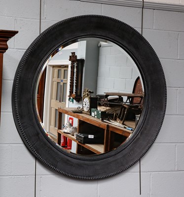 Lot 1187 - A large modern circular hanging mirror with...