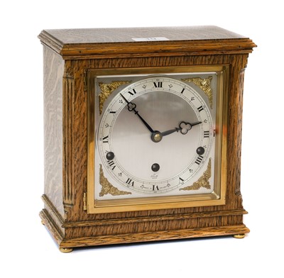 Lot 19 - An oak cased striking Elliot mantel clock, and...