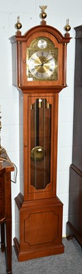 Lot 1101 - A modern chiming longcase clock retailed by...