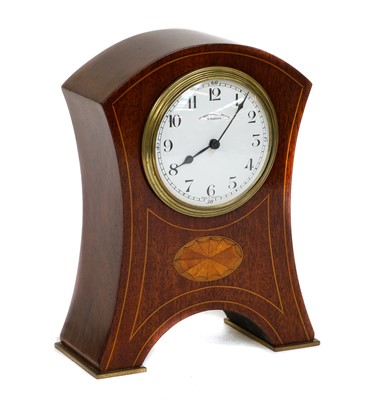 Lot 102 - A mahogany inlaid mantel timepiece, circa 1910,...