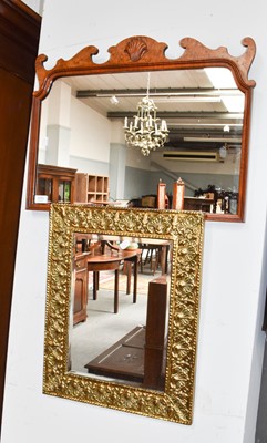 Lot 1111 - A Georgian style walnut wall mirror, with...