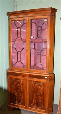 Lot 521 - A Georgian style mahogany glazed corner cabinet