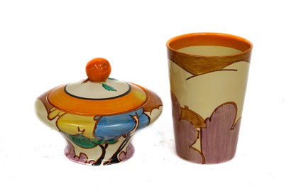 Lot 113 - Clarice Cliff beaker and a jar and cover