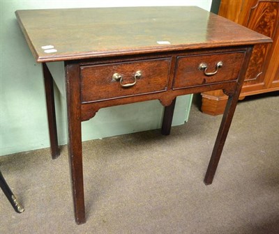 Lot 522 - A Georgian oak lowboy