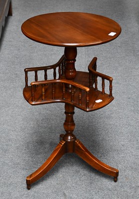 Lot 1118 - A mahogany occasional table with rotating...