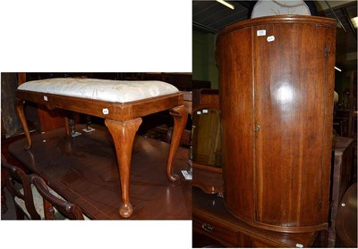 Lot 526 - A Georgian oak bow front corner cabinet and a walnut duet stool