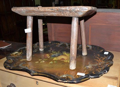 Lot 528 - A painted papier mache tray and a rustic four legged milking stool