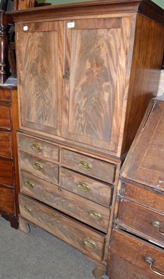 Lot 532 - Mahogany two door cupboard with a four height chest below (of small dimensions)