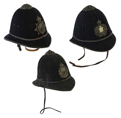 Lot 239 - Three Rose Top Police Helmets, each with cork...