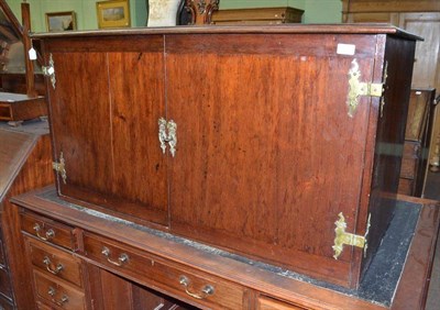 Lot 539 - A mahogany two door cabinet with brass mounts and green baize lining to the interior