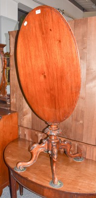 Lot 1114 - A Victorian carved mahogany tilt top table,...