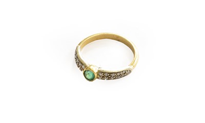 Lot 231 - An emerald and diamond ring, unmarked, finger...