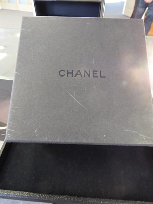 Lot 2169 - Chanel: A Lady's White Ceramic Centre Seconds Wristwatch