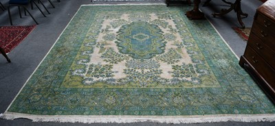 Lot 1003 - An oriental carpet, the cream field with...