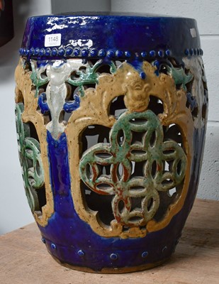 Lot 1148 - A Chinese earthen ware garden stool of barrel...