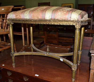 Lot 553 - Gilt dressing stool with shaped support