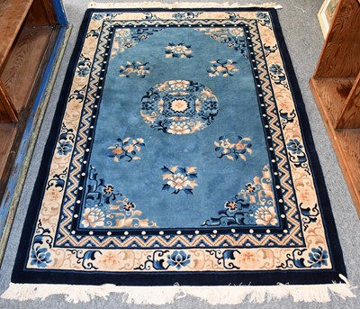 Lot 1012 - A Chinese rug, the sky-blue field with central...