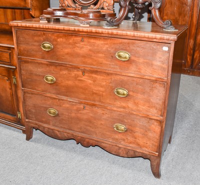 Lot 1121 - A Georgian mahogany straight front three...