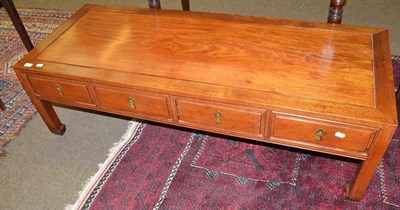 Lot 557 - A Chinese four drawer coffee table